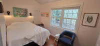 Bright Scandinavian-style cottage with large, private wooded yard