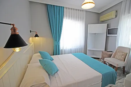 Hambarlı Otel Отели в г. Бозджаада