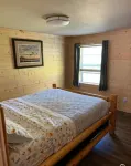 Cozy 2-bedroom cabin near endless trails. Family and pet friendly. Fire pit & AC