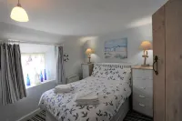 Sunbeam Cottage nestling in the heart of Branscombe village with a parking space