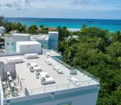 7 Mile Beach Penthouse with Private Beach Club. Ocean views from Roof Terrace.