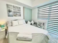Blissful Haven at Azure North w/  Big TV Netflix Washer Wifi Bed & Sofabed Hotels near Brgy Saguin Chapel