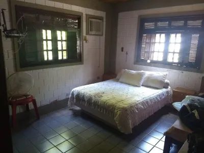 Beach house 5 minutes walk from the sea. Hotels near Coroa do Aviao Beach