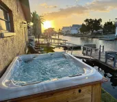Unique waterfront home, Hot Tub, private boat dock,  walk to beach, pet friendly