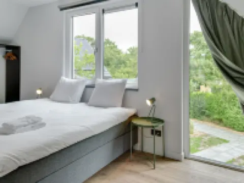 アトラクティブ ホリデーホーム ウィズ サウナ デ・コーフのホテル