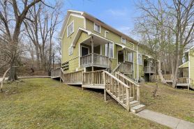 Multi-level condo with a fireplace, central AC, washer/dryer, & cable