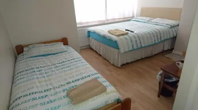 Room in Guest Room - Family Room Sleeps 3 with 1 Double and 1 Single Bed Ground Floor Private Shower
