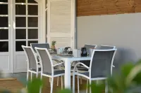 Charming outbuilding with large shaded terrace in private garden