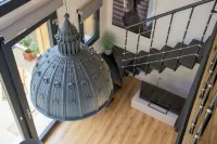 Open space on two floors in detached cottage in ancient medieval courtyard