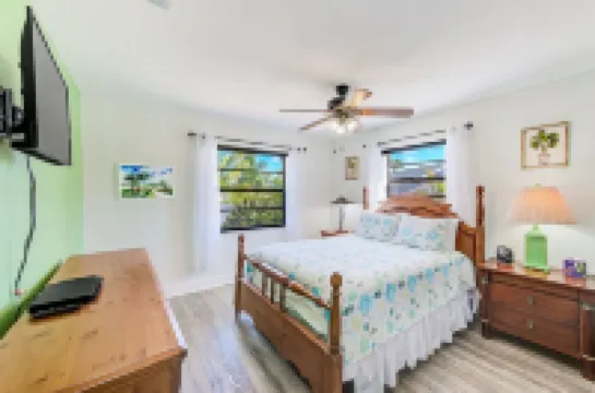 Waterfront oasis with private heated & screened pool, dock w/boat lift. 3BR/2BA