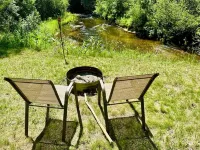 Charming 2-bedroom house with intimate Betsie River setting, AC, and WiFi