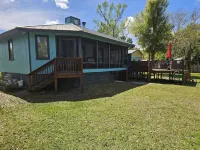 Cozy canal front house with its own boat ramp and dock. Amazing waterfront view.