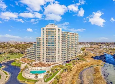Luxury Condo I Gated Resort l Direct Oceanfront l Across from Barefoot 🏝🕶☀️ Hotels near NMB Nature Trail