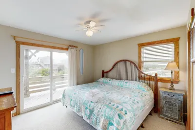 Towering beach house with private pool, hot tub, decks & ocean views