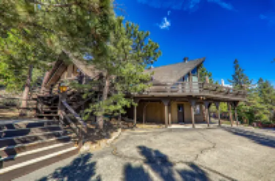 Charming Retreat with Lake Views and Spacious Deck - Inviting Escape