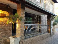 Falling Feather Inn Hotels near Waltloo Train Station
