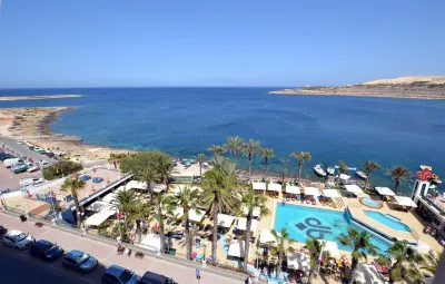 Qawra Palace Resort & Spa Hotels near Qawra Point Beach