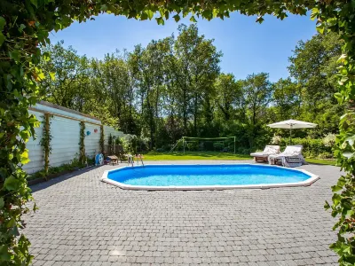 A Detached Bungalow with Outdoor Fireplace Covered Terrace and Pond in a Forest Plot Hotels in 