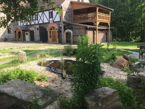 Secluded apartment above the stables in a historical mill house Hotel a Luban County