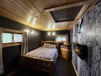 Charming 2-bedroom cabin with WiFi, AC near ATV routes, & Rock Dam Lake.