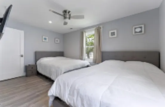 Stainless Steel Appliances and Flat-Screen TV - Modern Coastal Retreat