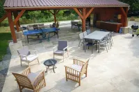 The farmhouse with the red shutters