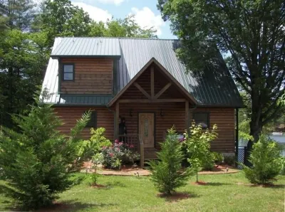 Ms Natalie Cabin on the Lake with Water Trampoline Hotels near 5th Ave. Consignment Boutique