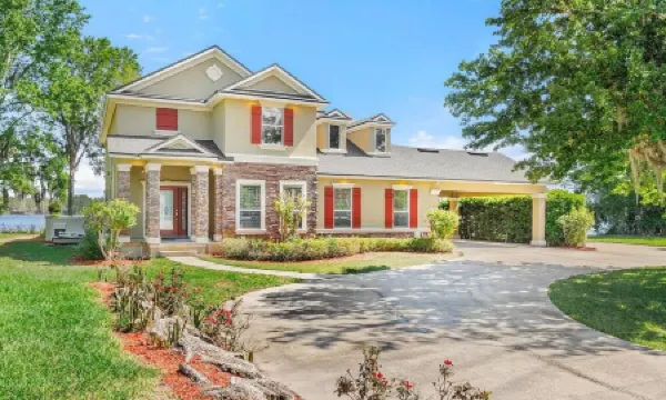 Lakeside Retreat~ Large home with pool, dock, game room and balcony on lakefront