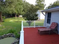 The Lake House at Turtle Cove: Cozy relaxing lake home with dock on wooded lot.