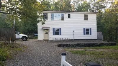 Year-round garage apartment on Lake Wassookeag with full amenities.