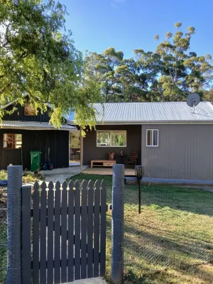 cosy cottage with wood heater, surrounded by bushland