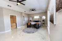 Enjoy this waterfront home with a pool, dock, and Blue Angels! Bring your boat!