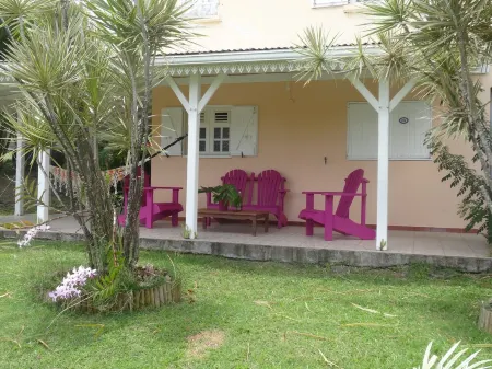 F2 Bottom corner villa with veranda and trees