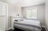 Torch Lake 4 bedroom home w/ large yard & parking