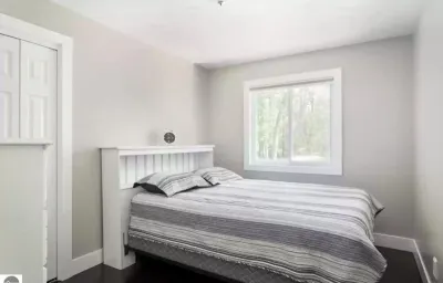 Torch Lake 4 bedroom home w/ large yard & parking