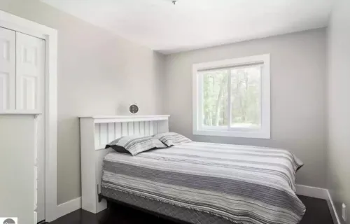 Torch Lake 4 bedroom home w/ large yard & parking