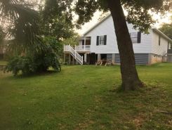 Home just off East Fowl River on deep water canal