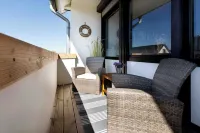 First-class, beachfront apartment with balcony near the family lagoon