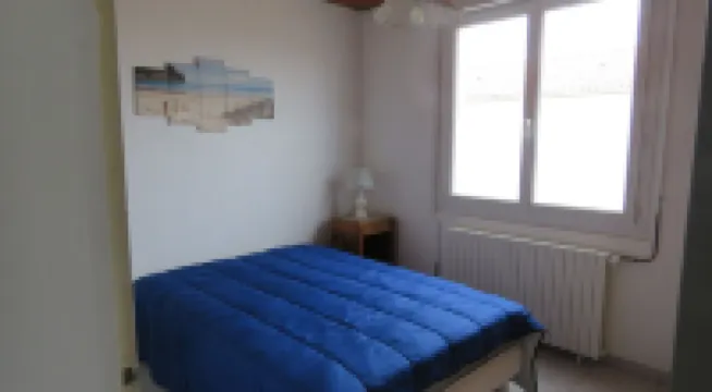 House near beach, port and shops, quiet area, private parking and courtyard.