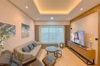 Modern Look with Wooden Accent 3BR at Kondominium Puncak Marina Apartment By Travelio