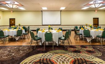 a large dining room with round tables and chairs arranged for a meeting or event at Best Western Wichita North