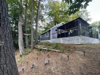 Cozy countryside cottage located on Crooked river in Naples Maine.