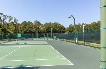 Peek of the ocean King size bed just Steps from the Beach