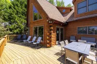 Enchanting 5-Bed/5-Bath Lakefront Log Cabin with Private Cove, Beach & Hot Tub.