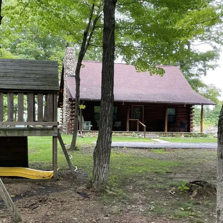 Beautiful log cabin with all the creature comforts of home. Private fishing lake