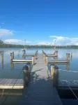 Beautiful waterfront condo with a boat dock, pool, and across from the beach