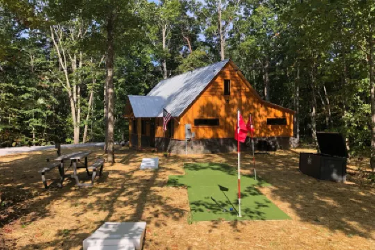 Charming Cabin Retreat with Hot Tub and Outdoor Games - Cozy Escape