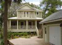 "The Palms" is nestled on a secluded half acre in the forest.  ThePalmsHouse.com