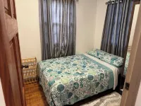 Cozy 2-bedroom house among the trees With WiFi and AC, Close to a Beach Hotel a