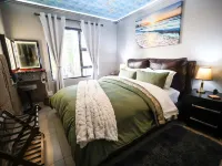 Luxury 2-Bedroom Apartment Near or Tambo with Private Garden & Heated Pool Hotels in Benoni